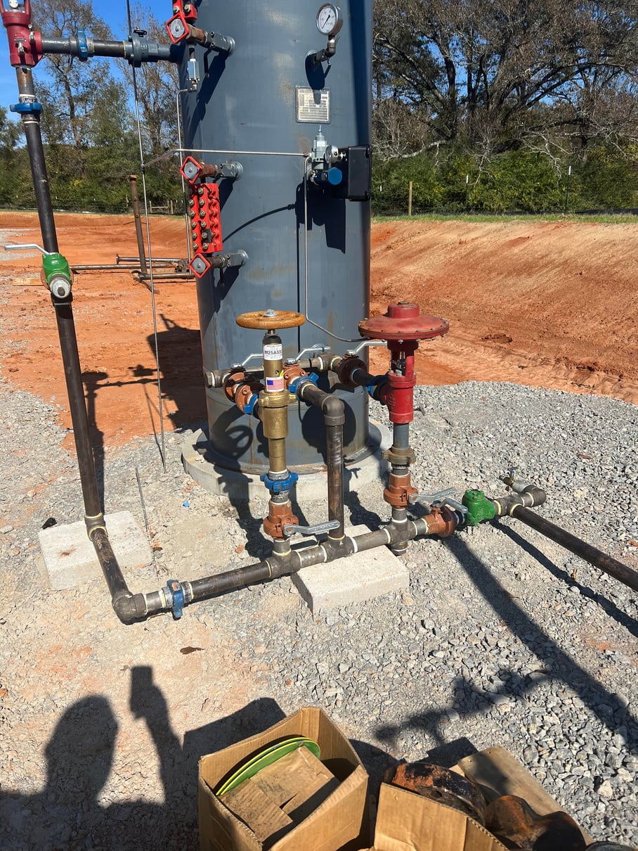 Vertical vessel with valves and piping